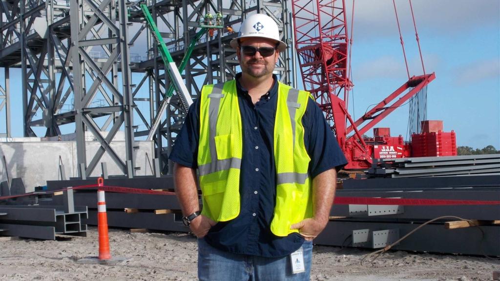 澳门足彩app's Aaron Ware posing on a jobsite.